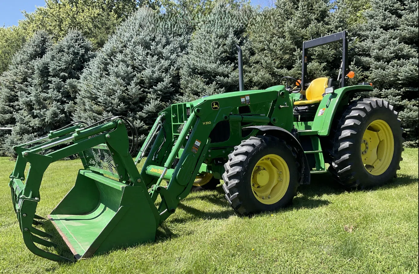 2010 John Deere 6115D MFWD Tractor with Grapple Loader, photo 1